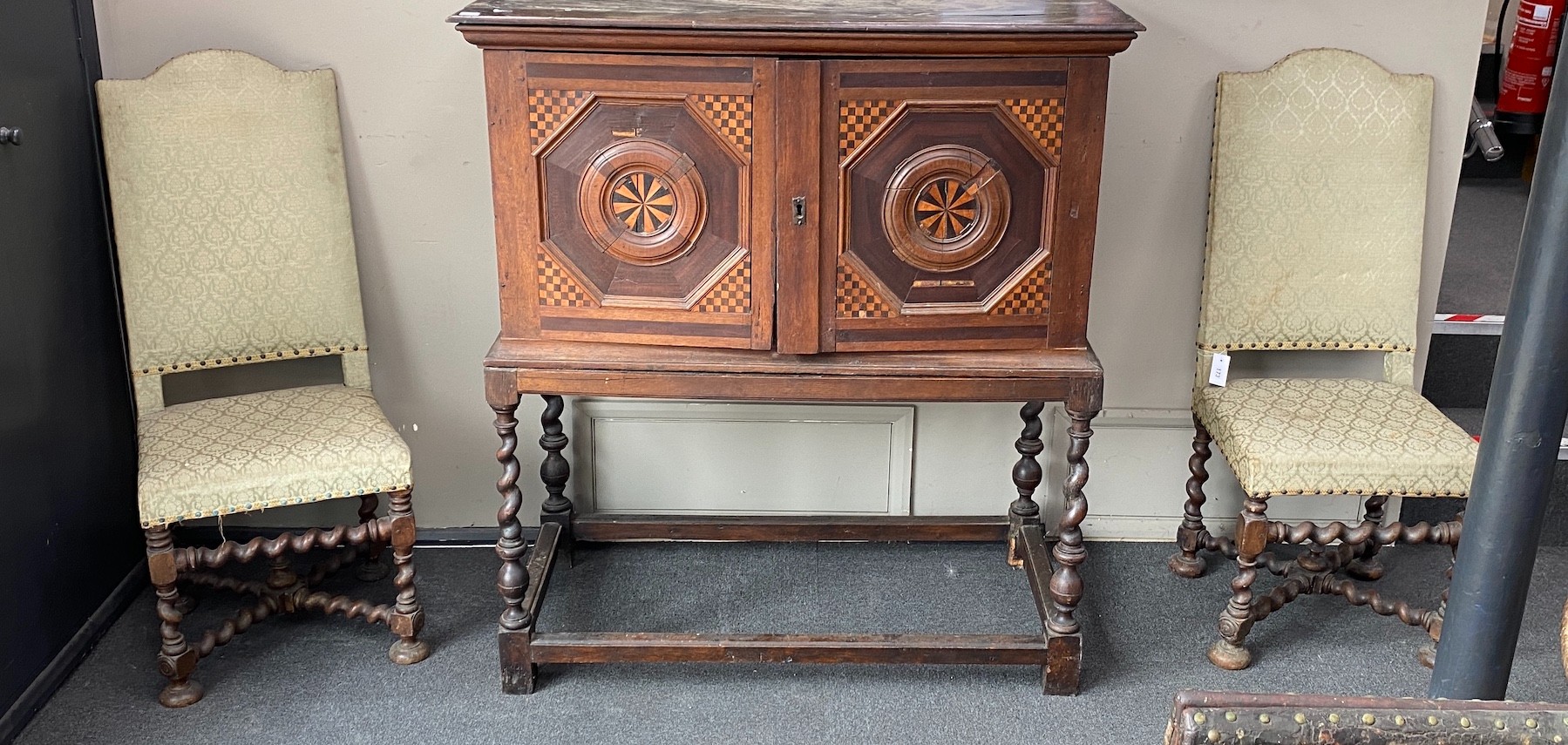 A pair of late 17th century walnut hall chairs with upholstered backs and seats on barley twist underframes, width 48cm, height 118cm